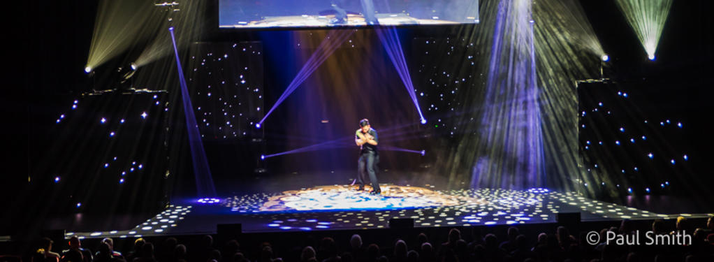 Photograph from Illusionists: Direct from Broadway - lighting design by Paul Smith