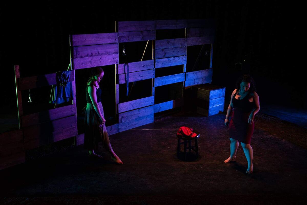 Photograph from We Like It Here - lighting design by Alan Mooney