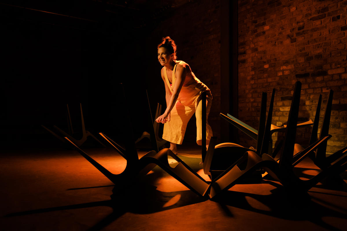 Photograph from 100 Years - lighting design by Claire Childs
