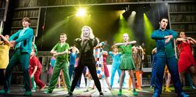 Photograph from Joseph and his Amazing Technicolour Dreamcoat - lighting design by Alexander Hoppe