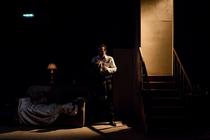 Photograph from Orphans - lighting design by Amy Mae